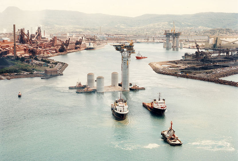 1996. The smaller oil rig being towed out of Port Kembla port.