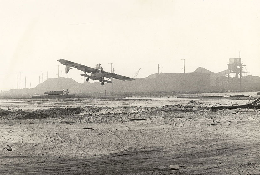 December 1975. An Airtruk taking off from a rough airstrip at Newcastle, NSW.