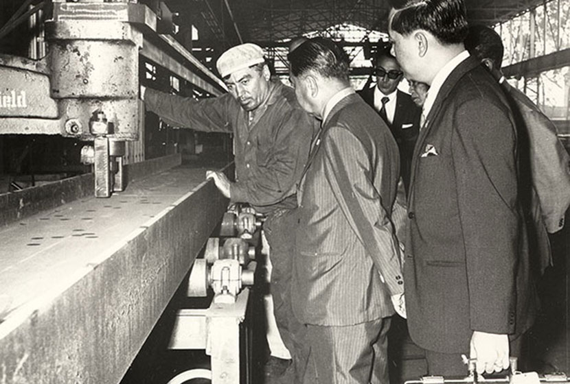 April 1972. Explaining how to drill a steel beam to a Thai delegation.
