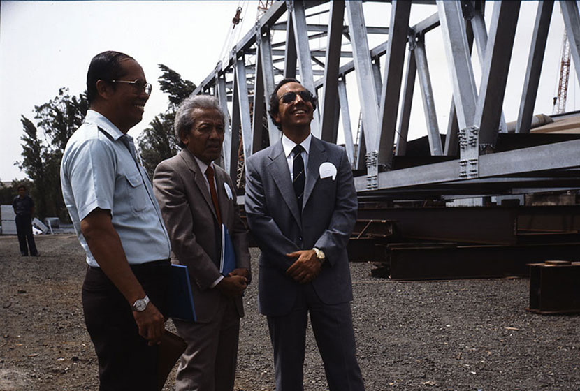 Paul Salteri (first from right) and Indonesian executives inspect a steel bridge.