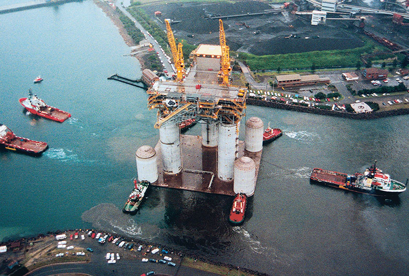 1996. Transfield's West Tuna oil rig, built for ESSO Australia, is towed out of its construction site.