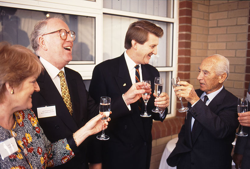 29 May 1996. Franco enjoys a glass of champagne with Premier Jeff Kennett after the “breaking the ground”.